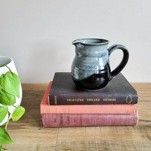 Hand made ceramic blue and black pitcher/creamer.